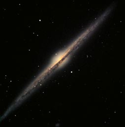 image of NGC4565, an edge-on spiral, courtesy of Frank
Hainley and John Burgess/Adam Block/NOAO/AURA/NSF